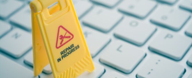 work laptop maintenance and repair underway sign on a keyboard